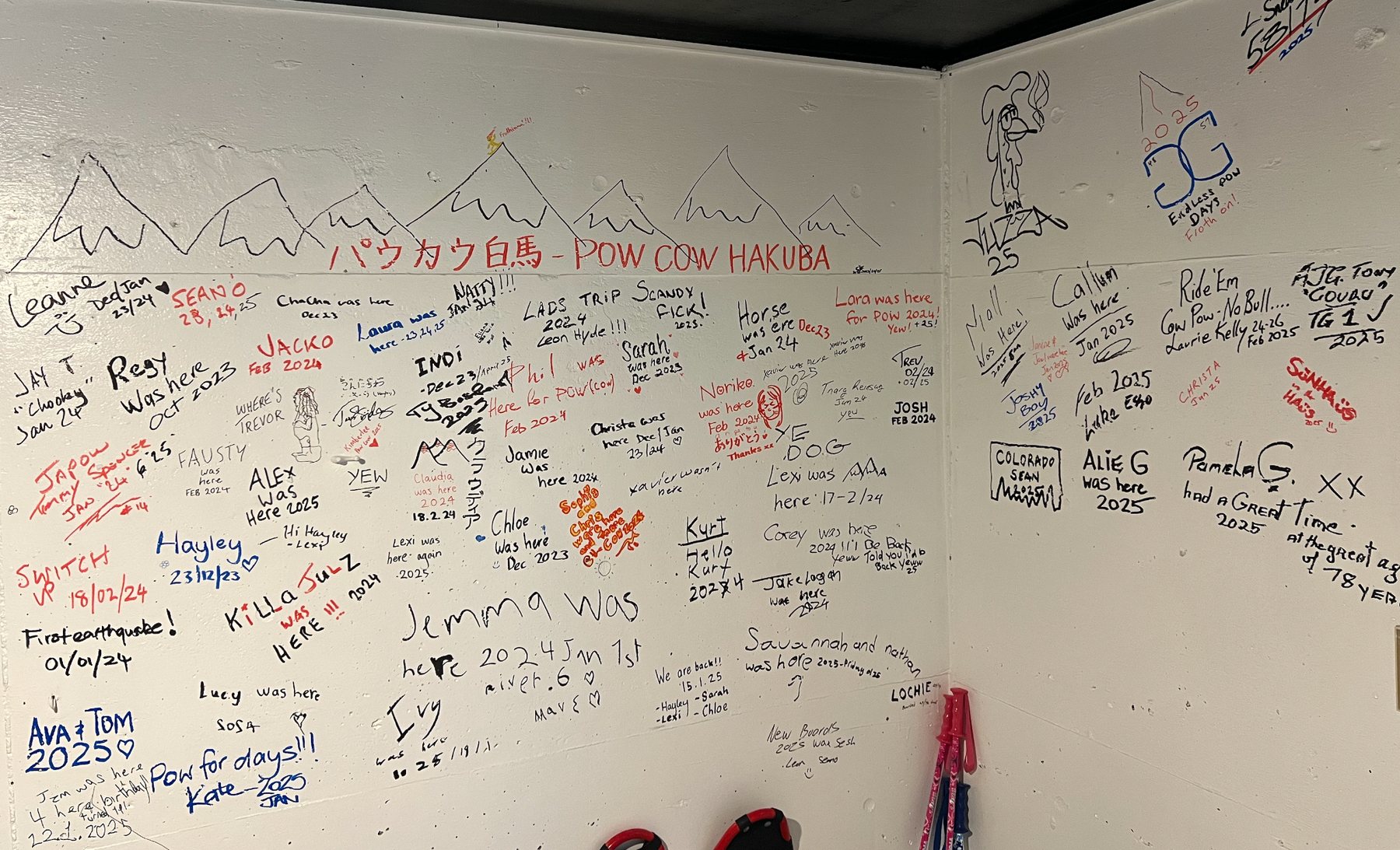 Guest signatures and drawings on the PowCow wall